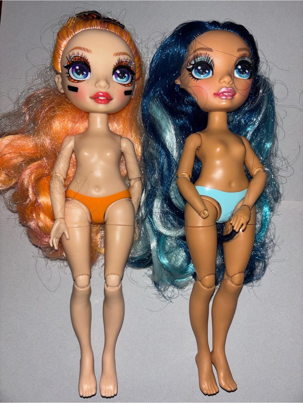 Rainbow high dolls Skylar Bradshaw and Poppy Rowan orange and blue